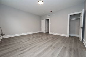 Philadelphia apartment for rent - a living room with wood flooring and a door to a closet