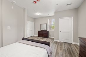 Greenville apartment for rent - an empty bedroom with a bed and a dresser