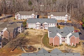 Shelby apartment for rent - A bird's eye view of a residential area with houses and a playground.