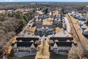Shelby apartment for rent - A bird's eye view of a residential area with houses and roads.