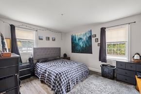 Concord apartment for rent - A bedroom with a bed, dresser, and window.