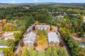 Concord apartment for rent - An aerial view of a residential area with houses and trees.