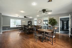 Topeka apartment for rent - A dining room with a wooden table and chairs.