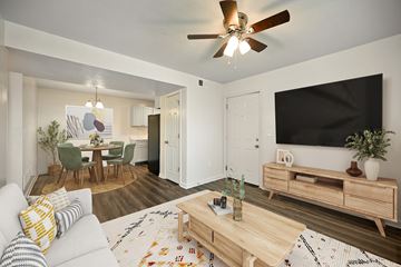 Topeka apartment for rent - A living room with a white couch and a wooden coffee table.