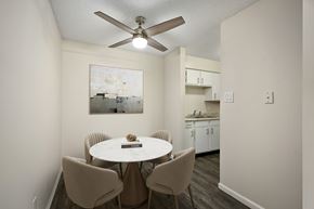 Topeka apartment for rent - A dining room with a white table and chairs.