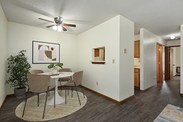 Topeka apartment for rent - A dining room with a white table and chairs.