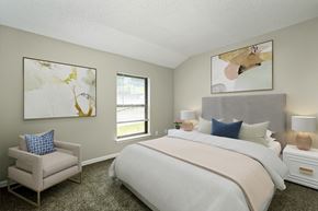 Lawrence apartment for rent - a bedroom with a large bed and two paintings on the wall