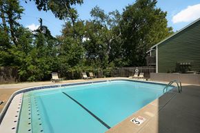 Lawrence apartment for rent - a swimming pool in a backyard next to a house