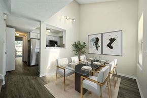 Lawrence townhouse for rent - a dining room with a table and chairs