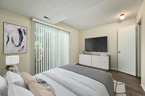 Lawrence townhouse for rent - the preserve at ballantyne commons bedroom with large bed and tv