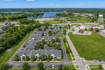Topeka apartment for rent - A bird's eye view of a residential area with houses, roads, and a water tower.