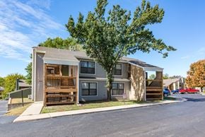 Topeka apartment for rent - our apartments feature a spacious community area with a tree and balconies