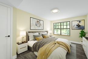 Topeka apartment for rent - A bedroom with a bed, nightstands, and a window.