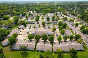 Topeka apartment for rent - A bird's eye view of a residential area with apartments, duplexes, and trees.