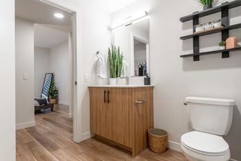 A bathroom with a wooden cabinet