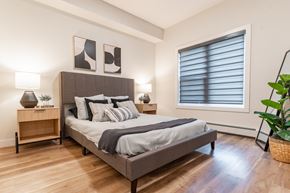 Edmonton apartment for rent - A Bedroom With Two Lamps at Cadence at Griesbach, Alberta, T5E 1Y8