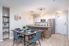 Edmonton apartment for rent - A kitchen with a dining table and chairs. at G17 Apartments at Tamarack, Edmonton, T6T 2M4
