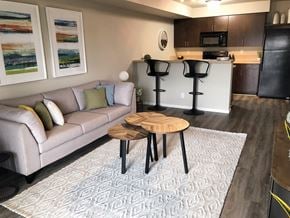 Regina apartment for rent - Interior - wide shot of living room and kitchen area.