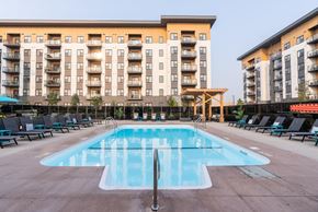 Sherwood Park apartment for rent - A large swimming pool in front of apartment buildings.