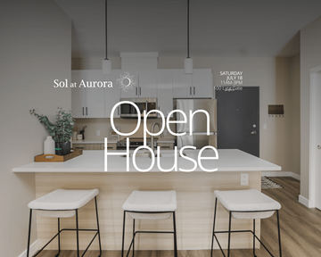 Winnipeg apartment for rent - A modern kitchen with a bar stool and a sign that says Open House.