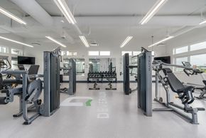 Sherwood Park apartment for rent - A gym with a variety of equipment including treadmills, weights, and exercise machines.