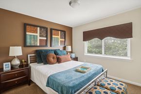 Suitland apartment for rent - a bedroom with a bed and a window at Andrews Ridge Apartments, Suitland, MD