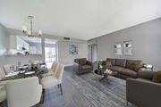 West Palm Beach townhouse for rent - A modern living room with a dining table and chairs.