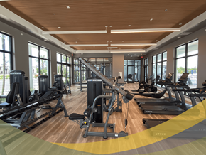 Fort Myers apartment for rent - a gym with cardio equipment and windows in a building