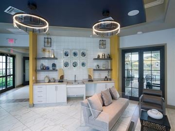 Fort Myers apartment for rent - a living room with a couch and a kitchen with lights