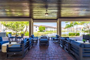 Patio with blue chairs and tables