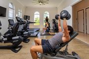 Naples townhouse for rent - A man lifting weights at The Falls of Portofino , Naples, Florida