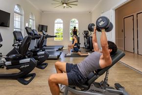 Naples townhouse for rent - A man lifting weights at The Falls of Portofino , Naples, Florida