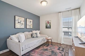 Lebanon apartment for rent - A living room with a grey couch and a rug.