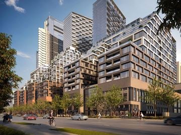Toronto apartment for rent - A modern cityscape with tall buildings and a clear sky.