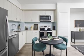 Toronto apartment for rent - a kitchen and dining room with a table and chairs