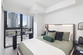 Toronto apartment for rent - a bedroom with a bed and a large window