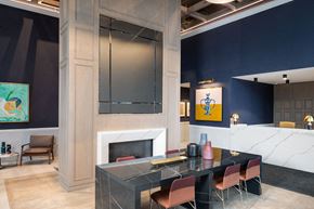 Toronto apartment for rent - a dining room with a table and chairs and a fireplace