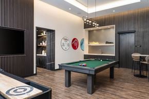 Toronto apartment for rent - a games room with a pool table and a television