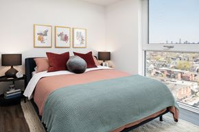Toronto apartment for rent - a bedroom with a bed and a large window