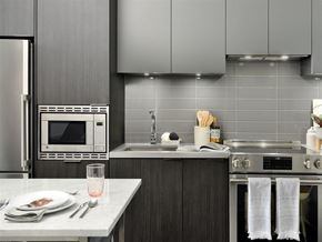 Toronto apartment for rent - A modern kitchen with a table set for two.