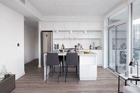 Toronto apartment for rent - A modern kitchen with a dining table and chairs.