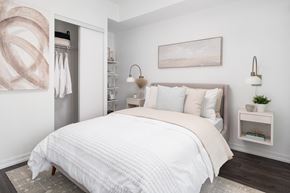 Toronto apartment for rent - a bedroom with a bed and a closet
