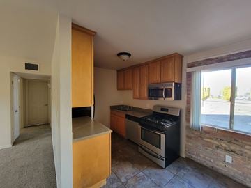 Sierra Vista apartment for rent - A kitchen with a stove top oven and microwave.