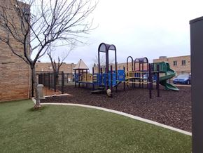 Sierra Vista apartment for rent - A playground with a green slide and a blue slide.