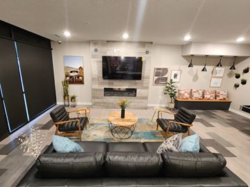 Salt Lake City apartment for rent - a living room with couches and chairs and a tv
