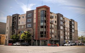 Salt Lake City apartment for rent - A large apartment building with a traffic light in front of it