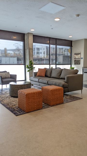 Salt Lake City apartment for rent - a living room with a couch and chairs and a large window