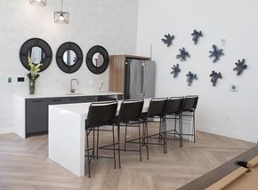 Salt Lake apartment for rent - a white kitchen with black mirrors on the wall