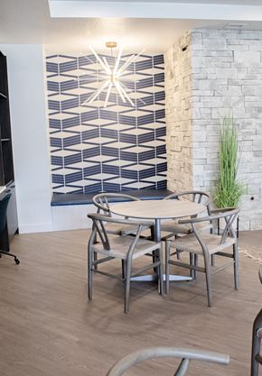 Salt Lake apartment for rent - A table and chairs in front of a brick wall