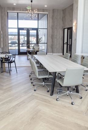 Salt Lake apartment for rent - Conference room with a wooden table and white chairs